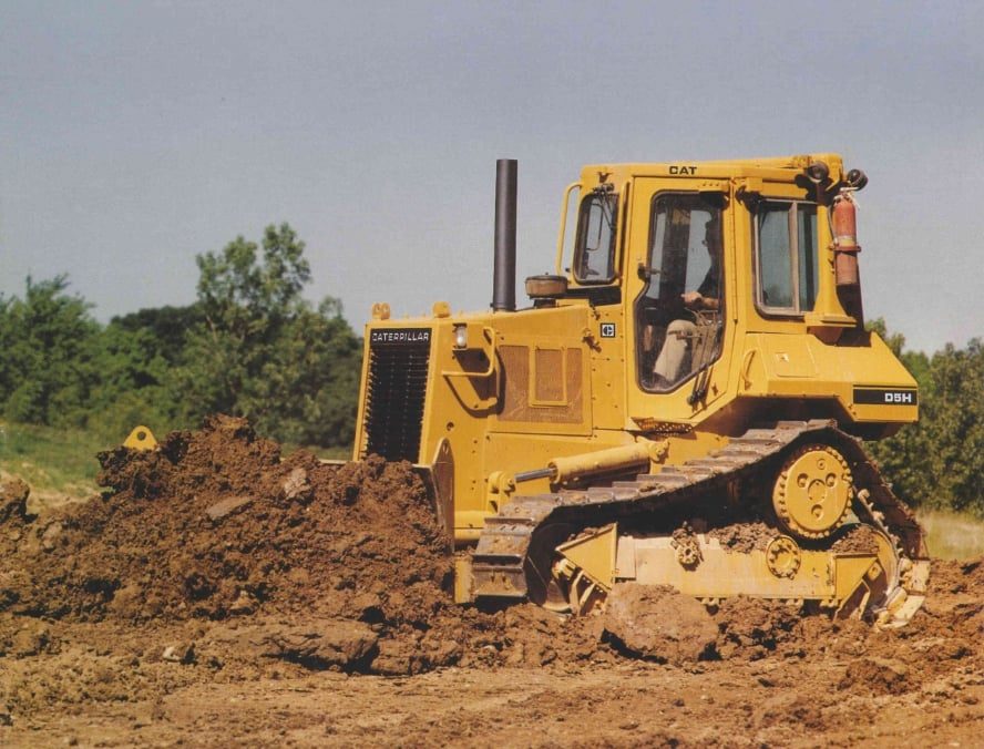 Cat D5H bulldozer grading and pad work